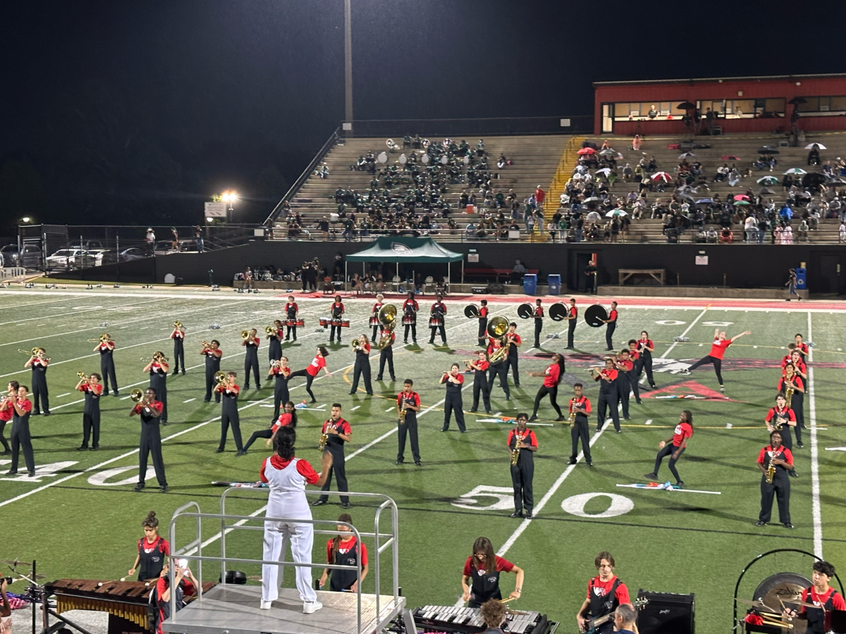 The Marching Band and Color Guard perform at their first home game of the school year against Collins Hills during the half-time show on Aug. 22. Photo credit Anuradha Gudapati