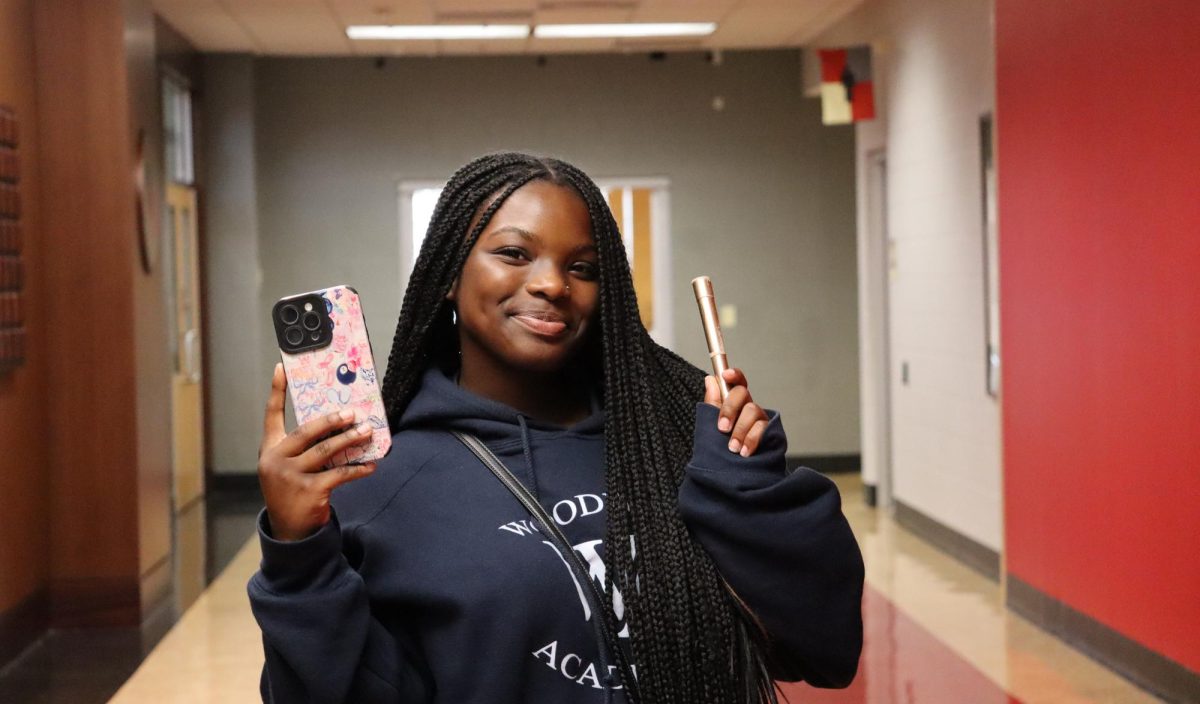 Joy Ferguson '29 poses with her phone and mascara. Photo credit Alex Piazza '28