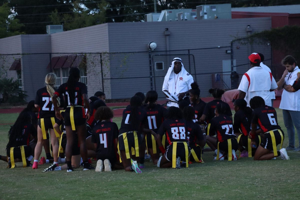 Coach Terry Myrick talks to the team between matches during their first preseason game-day. He gave great suggestions that encouraged improvement and uplifted spirits. Photo credit Baylee Dobson