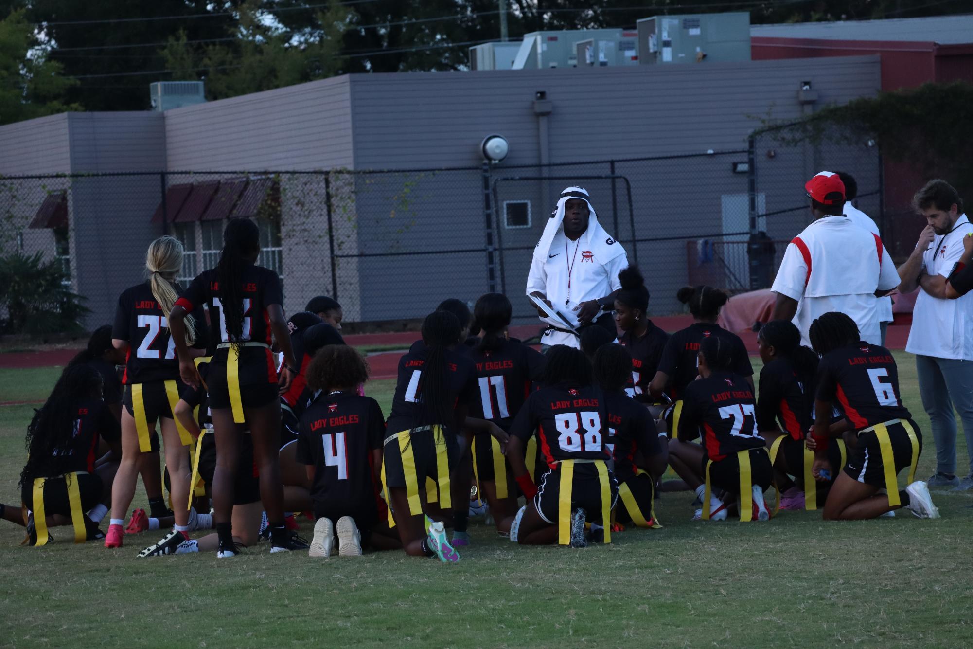 Coach Terry Myrick talks to the team between matches during their first preseason game-day. He gave great suggestions that encouraged improvement and uplifted spirits. Photo credit Baylee Dobson